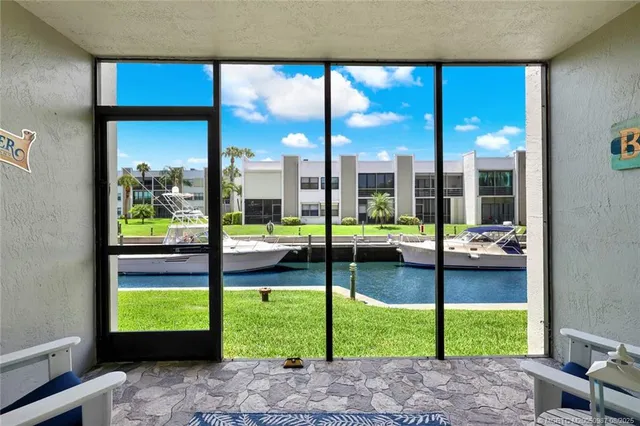 a view of swimming pool with seating area and barbeque oven