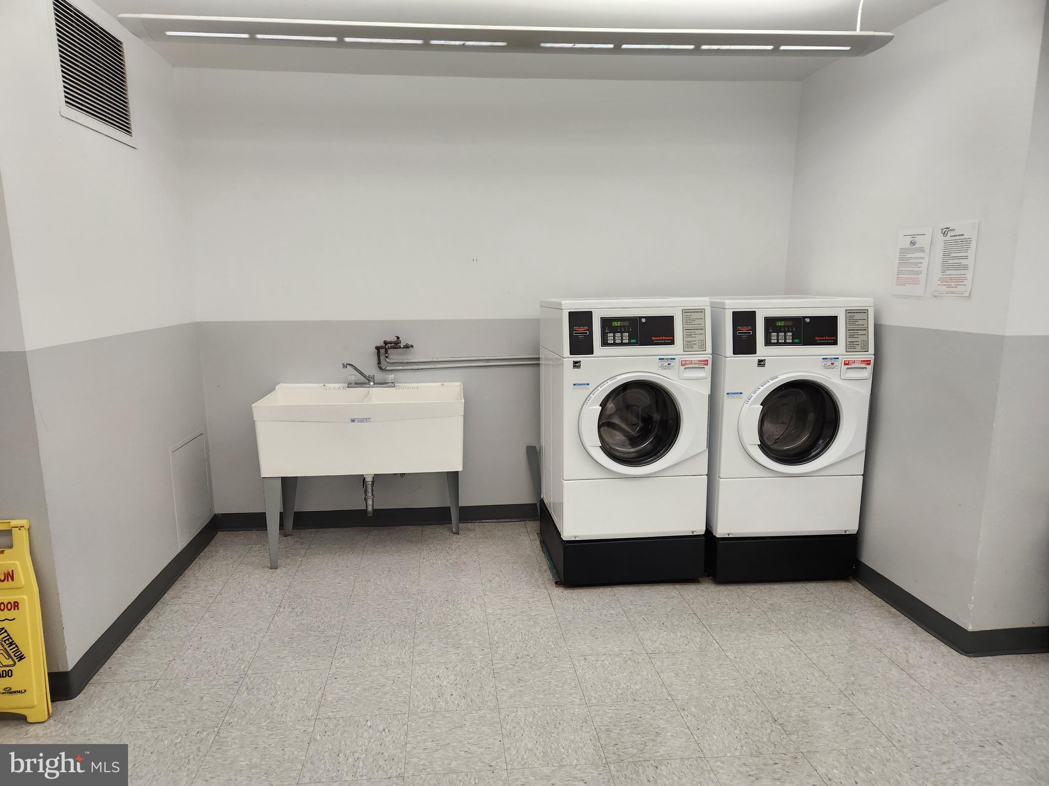 4201 Cathedral Avenue Northwest, Unit 1012E Washington, DC 20016 - Photo 12 of 18 a utility room with dryer and washer