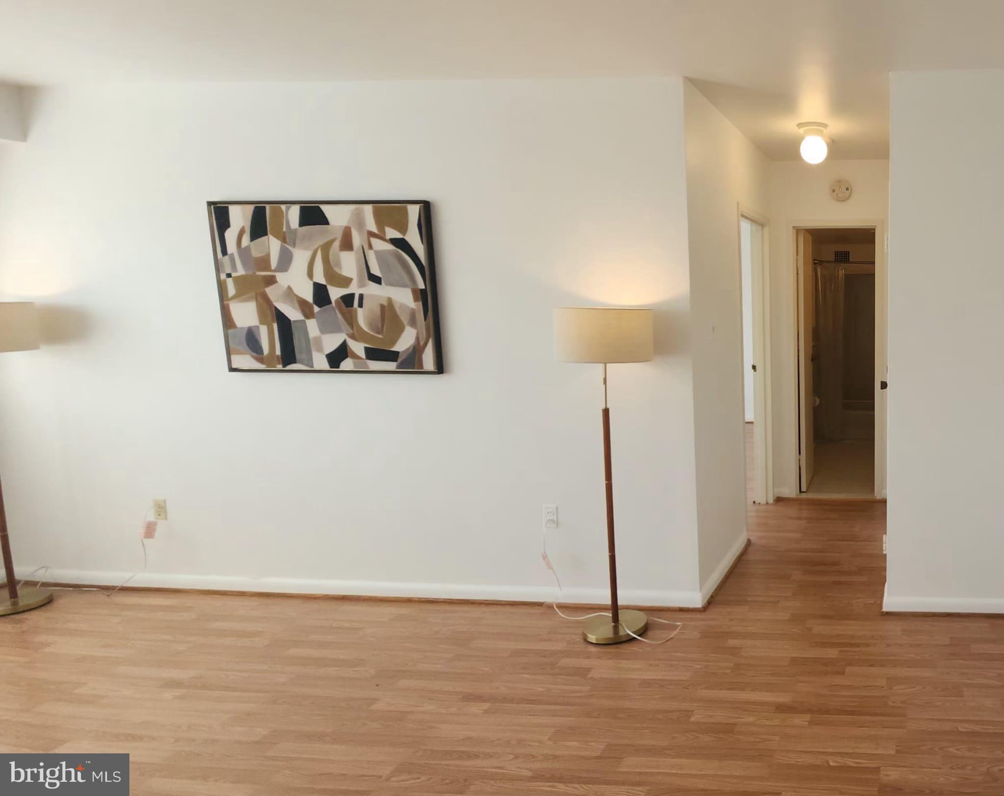 4201 Cathedral Avenue Northwest, Unit 1012E Washington, DC 20016 - Photo 4 of 18 a view of a room with wooden floor