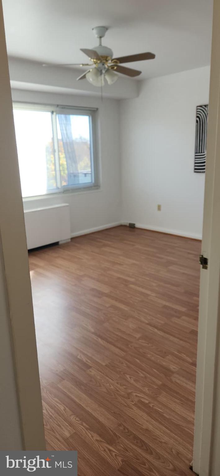 4201 Cathedral Avenue Northwest, Unit 1012E Washington, DC 20016 - Photo 6 of 18 a view of an empty room with a window