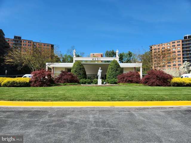 a view of a big yard with a swimming pool and outdoor seating