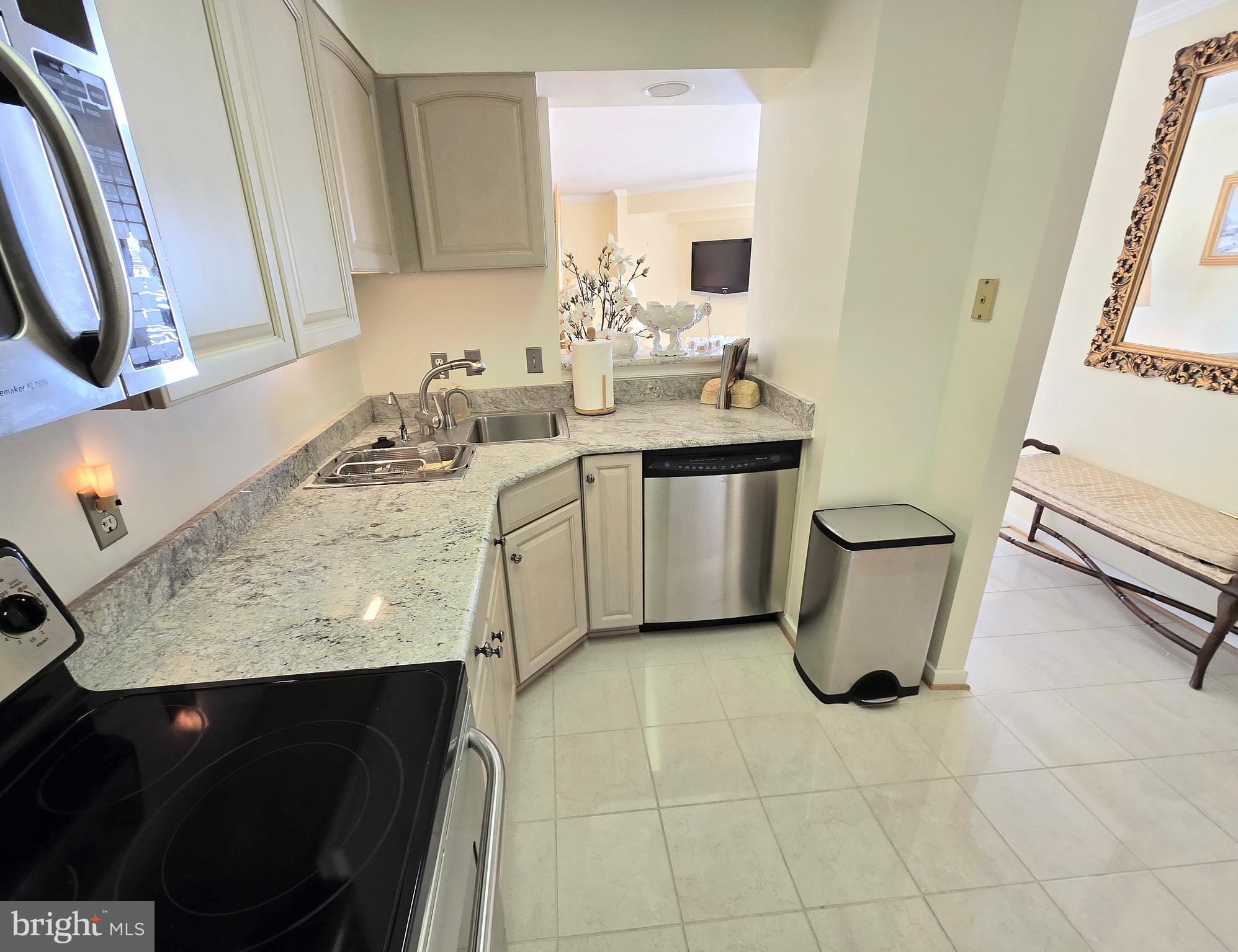 2111 Wisconsin Avenue Northwest, Unit 401 Washington, DC 20007 - Photo 2 of 16 a bathroom with a sink toilet and mirror
