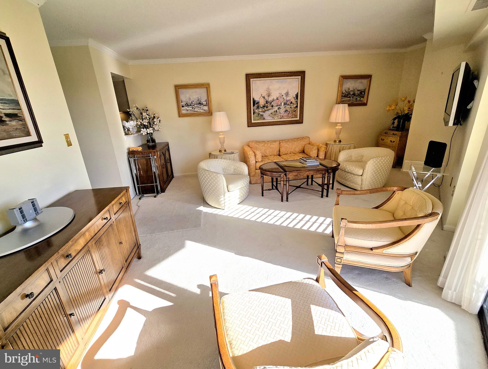 2111 Wisconsin Avenue Northwest, Unit 401 Washington, DC 20007 - Photo 6 of 16 a living room with furniture and a flat screen tv