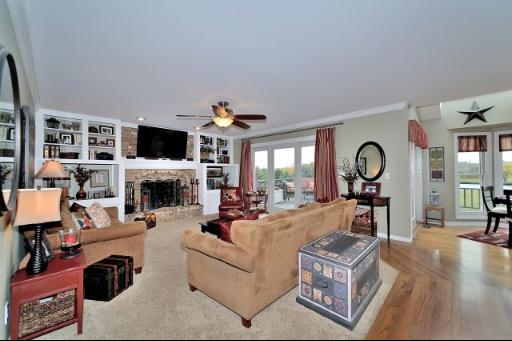 3N684 Ridgeview Court St. Charles, IL 60175 - Photo 4 of 16 a living room with furniture a fireplace and a flat screen tv