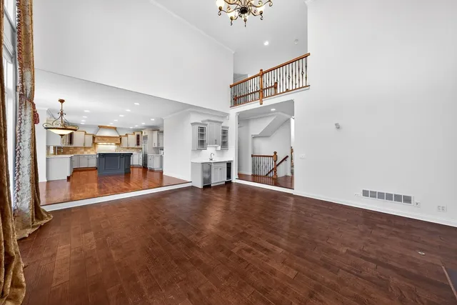 a very nice looking room with a large window and chandelier