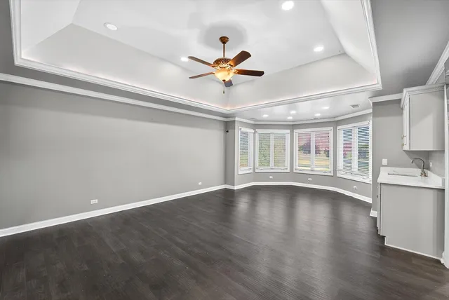 a large bathroom with a large tub and sink