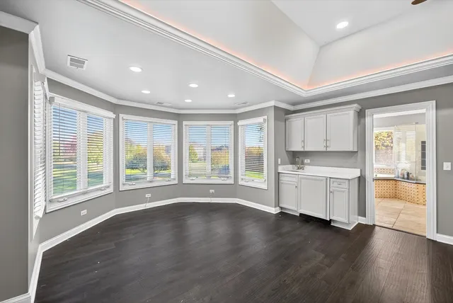 a bathroom with a bathtub and next to a window