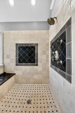 a view of walk in closet with wooden floors and stairs