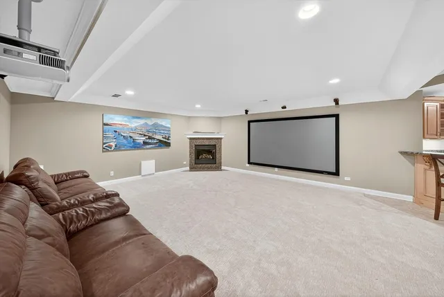 an empty room with fan and windows