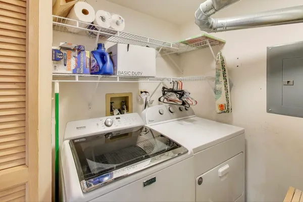 a utility room with dryer and washer