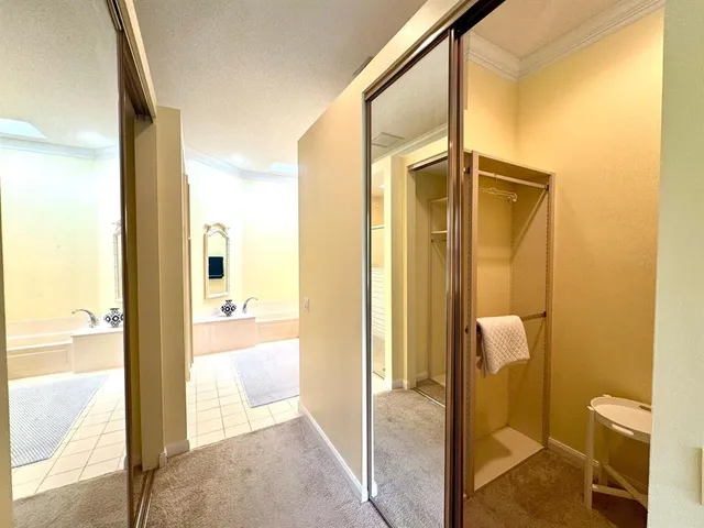 a view of a bathroom with a tub and shower