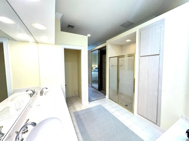 a bathroom with a bathtub sink and mirror