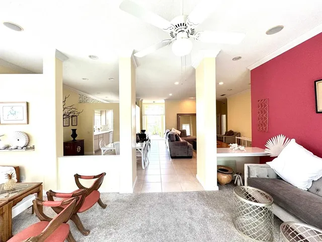 a spacious bedroom with a bed and a large window