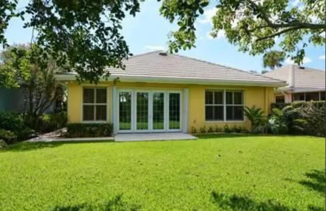 a bathroom with a toilet a sink and a large mirror
