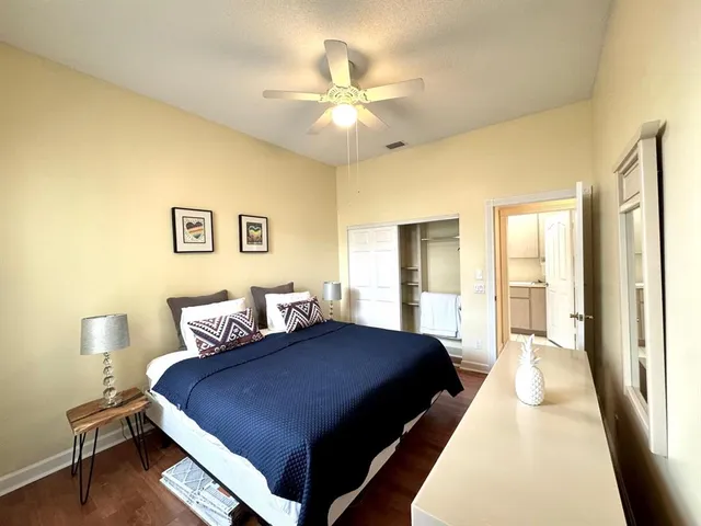 a bedroom with a bed and window