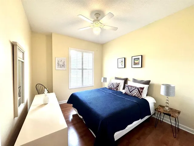 a bedroom with two beds and a window