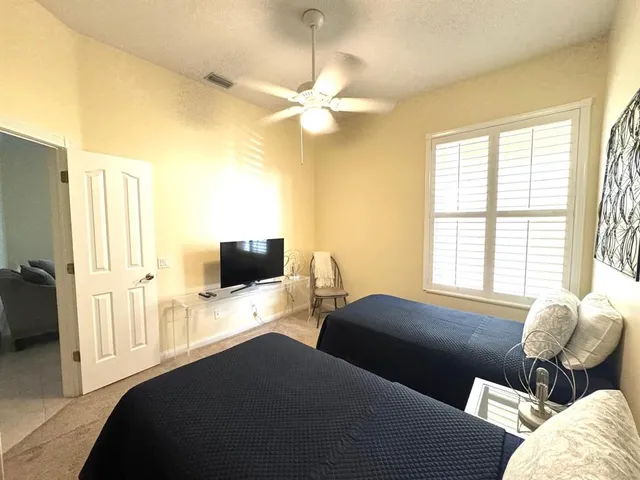 a bedroom with a bed and tv