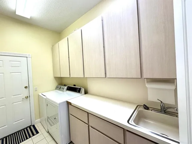 a kitchen with a stove and a white refrigerator