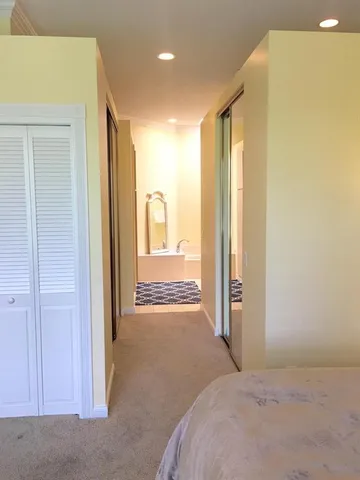 a view of a bathroom with a tub and shower