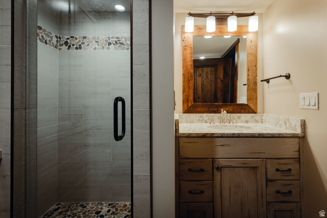 1667 West Tollgate Cyn Road Coalville, UT 84017 - Photo 47 of 61 Glass-enclosed shower with pebble tile floor and accent band