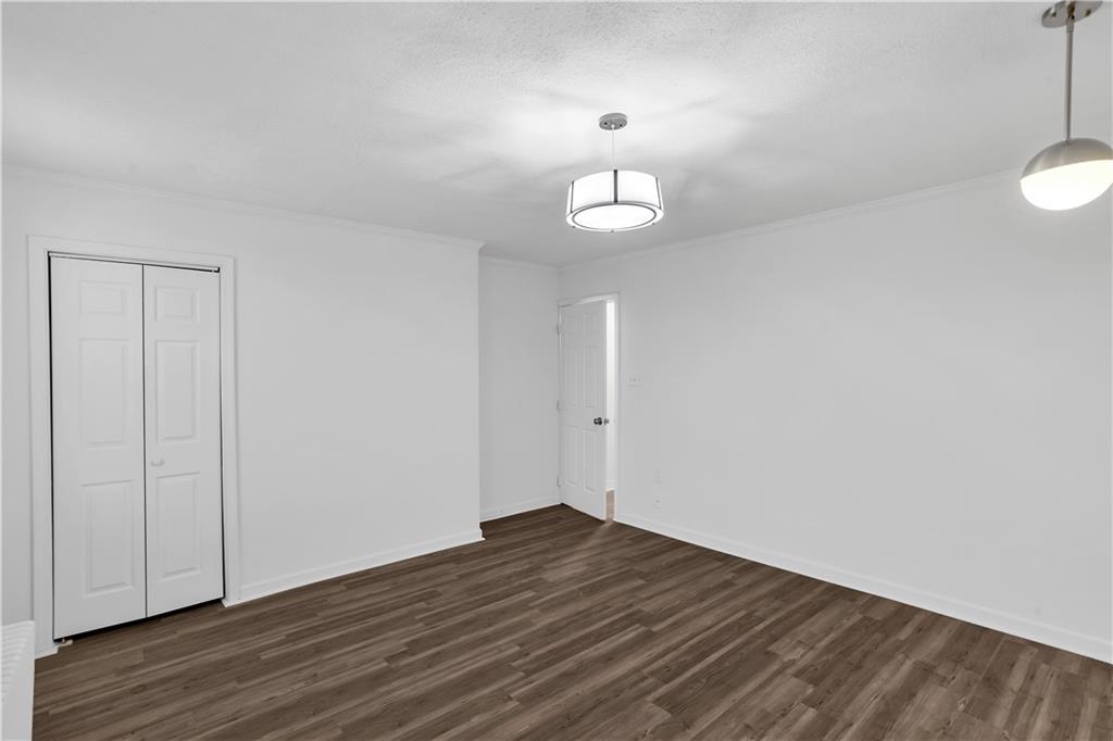 1841 Chislett Street Pittsburgh, PA 15206 - Photo 15 of 28 an empty room with wooden floor and window