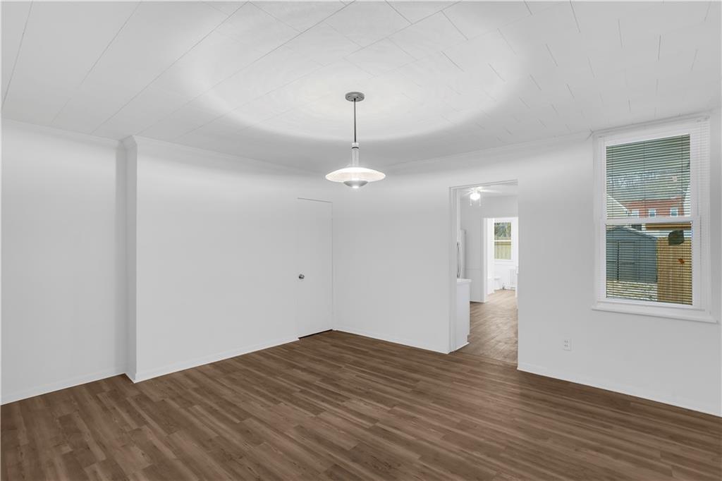 1841 Chislett Street Pittsburgh, PA 15206 - Photo 19 of 28 a view of empty room with wooden floor and ceiling fan