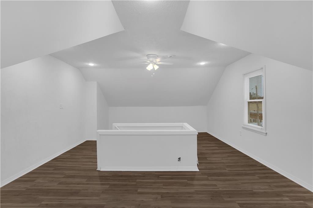 1841 Chislett Street Pittsburgh, PA 15206 - Photo 21 of 28 a view of an empty room with wooden floor and a ceiling fan