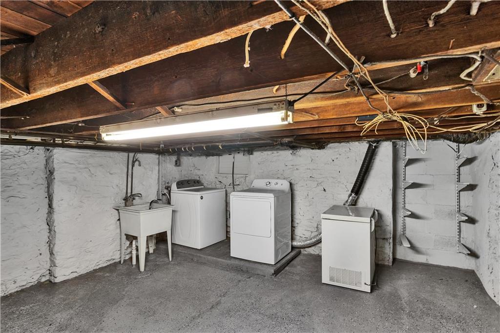 1841 Chislett Street Pittsburgh, PA 15206 - Photo 25 of 28 a utility room with dryer and washer
