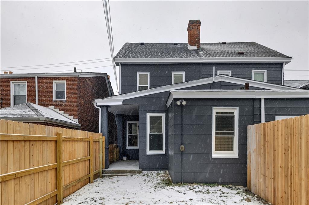 1841 Chislett Street Pittsburgh, PA 15206 - Photo 27 of 28 a front view of a house with a yard