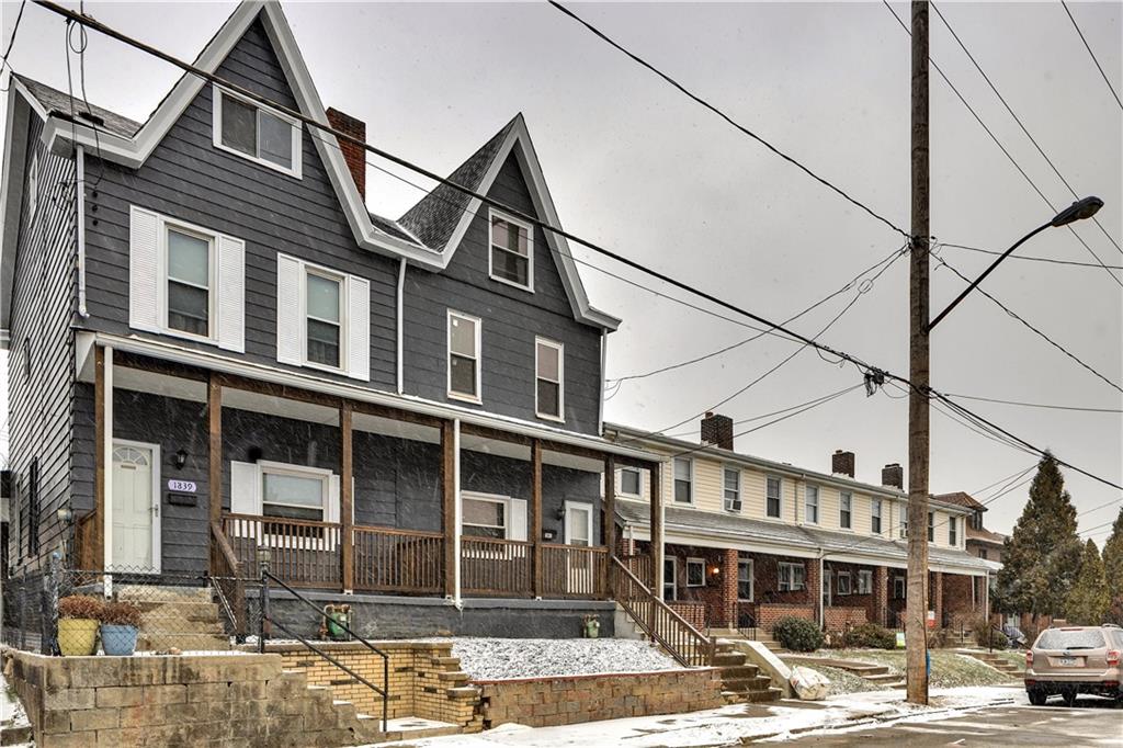 1841 Chislett Street Pittsburgh, PA 15206 - Photo 3 of 28 a front view of a house with a yard