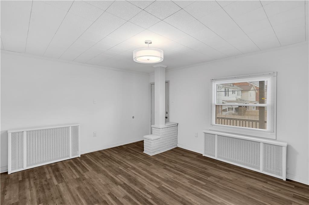 1841 Chislett Street Pittsburgh, PA 15206 - Photo 6 of 28 a view of empty room with wooden floor and fan