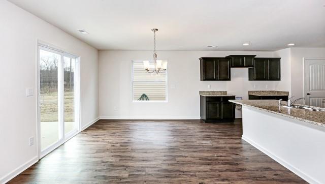 Picture not of Actual Home - Dining space is open to living room and kitchen and opens on to outdoor patio.