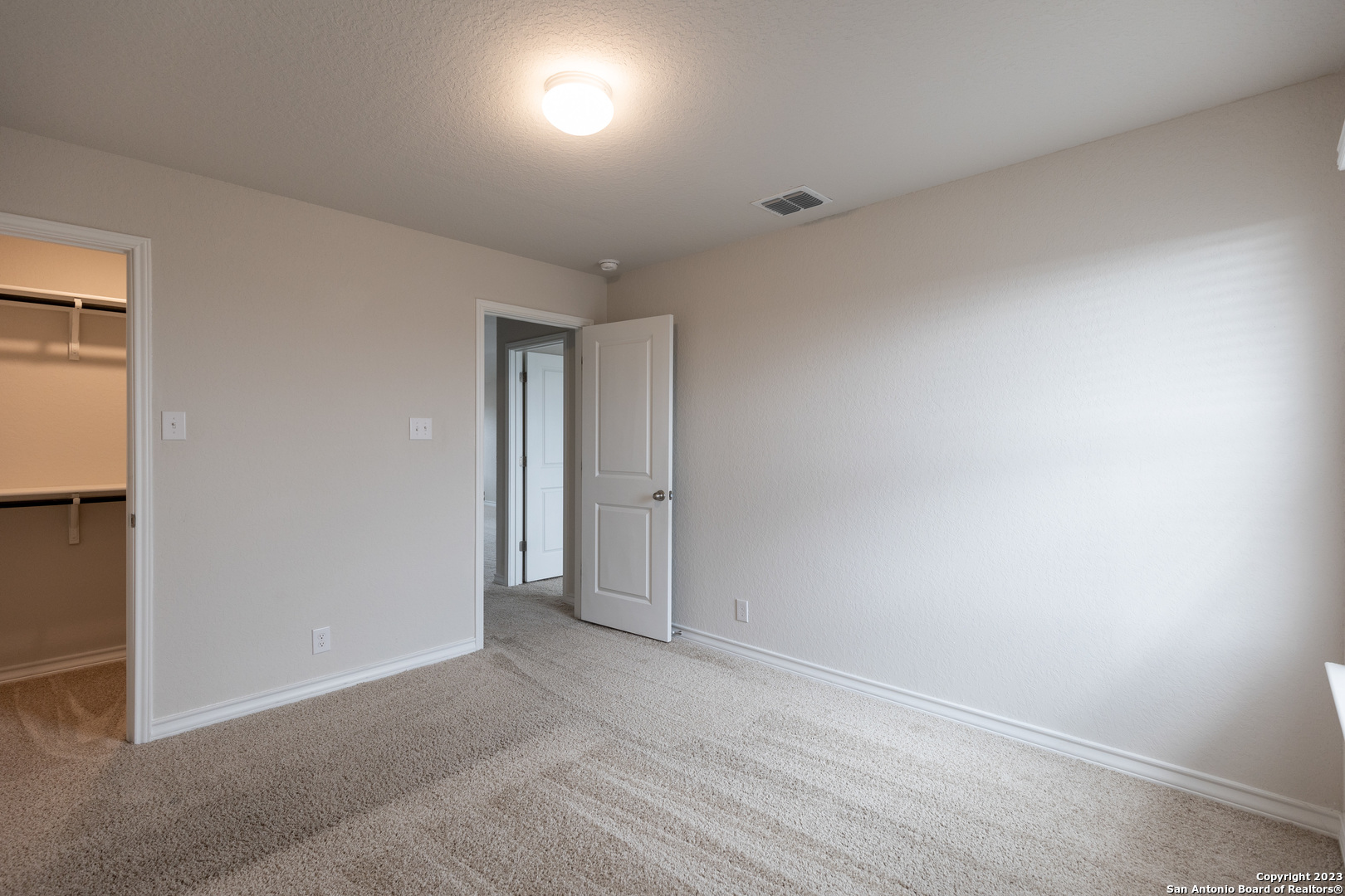 9819 Bratten Rise San Antonio, TX 78254 - Photo 30 of 37 an empty room with an entryway