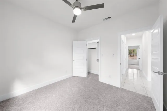 an empty room with a bathroom