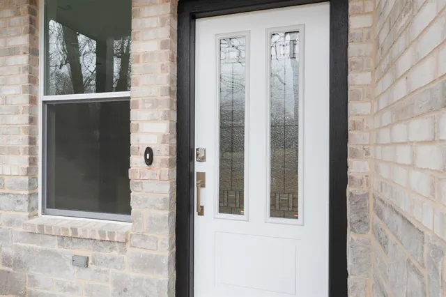 a view of a door and a window