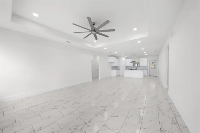 a view of a kitchen with a sink and a window