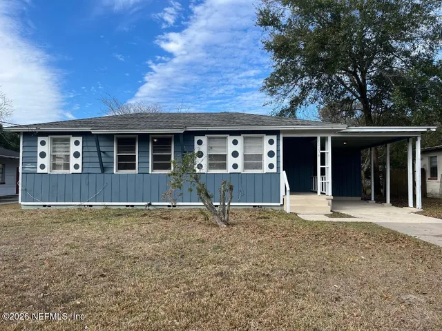 a house with trees in the background