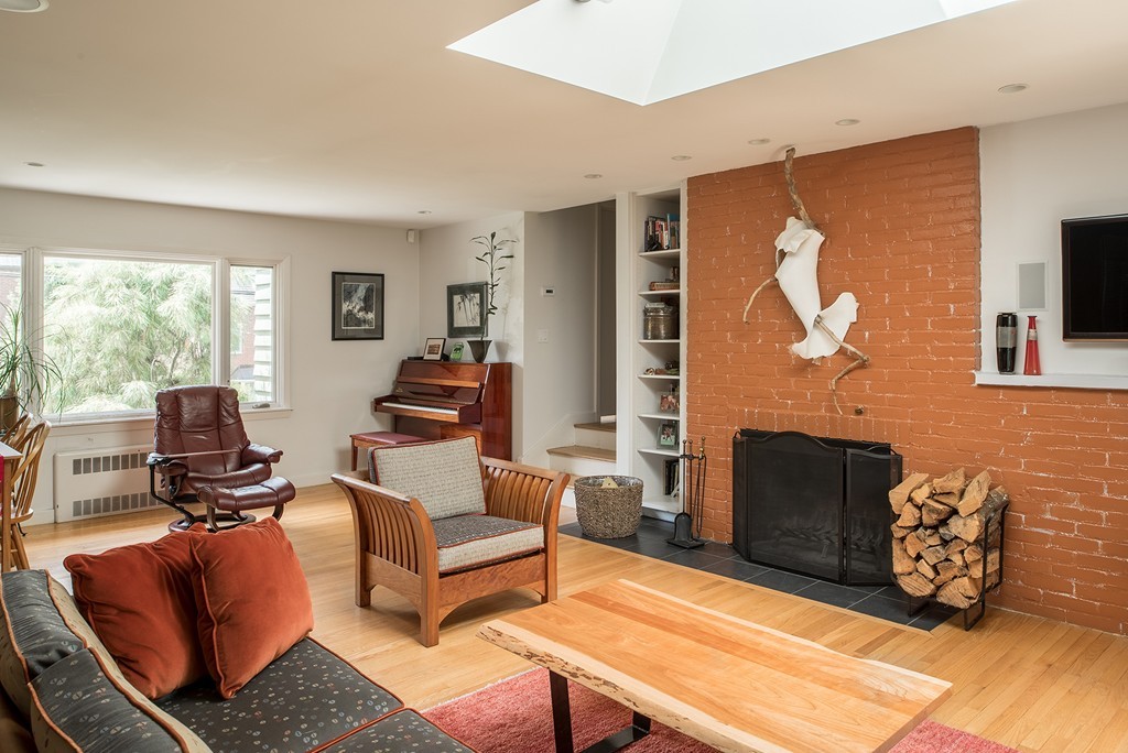 39 Clements Road Newton, MA 02458 - Photo 4 of 11 a living room with furniture a flat screen tv and a fireplace