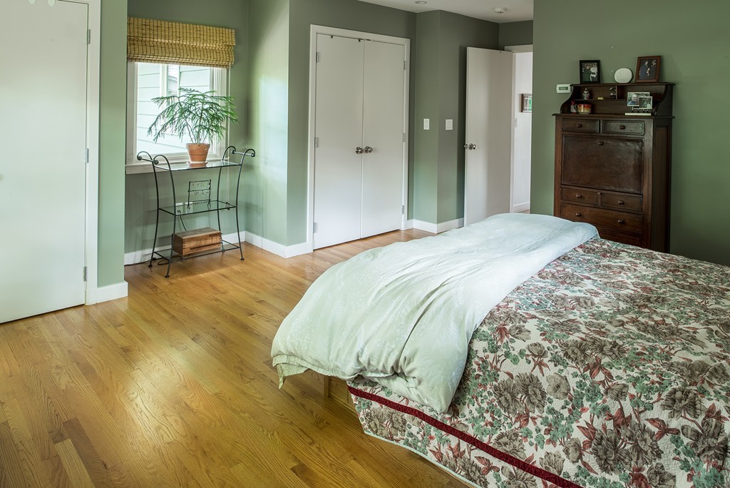 39 Clements Road Newton, MA 02458 - Photo 5 of 11 a bedroom with a bed and wooden floor
