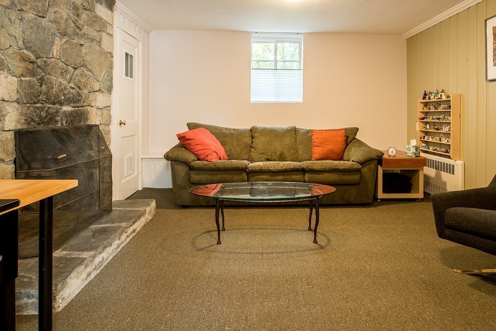 39 Clements Road Newton, MA 02458 - Photo 9 of 11 a living room with furniture and a fireplace