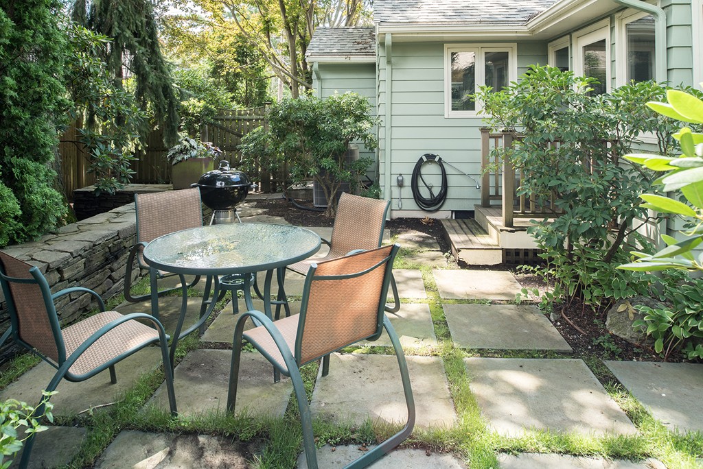 39 Clements Road Newton, MA 02458 - Photo 10 of 11 a view of a patio with table and chairs and potted plants