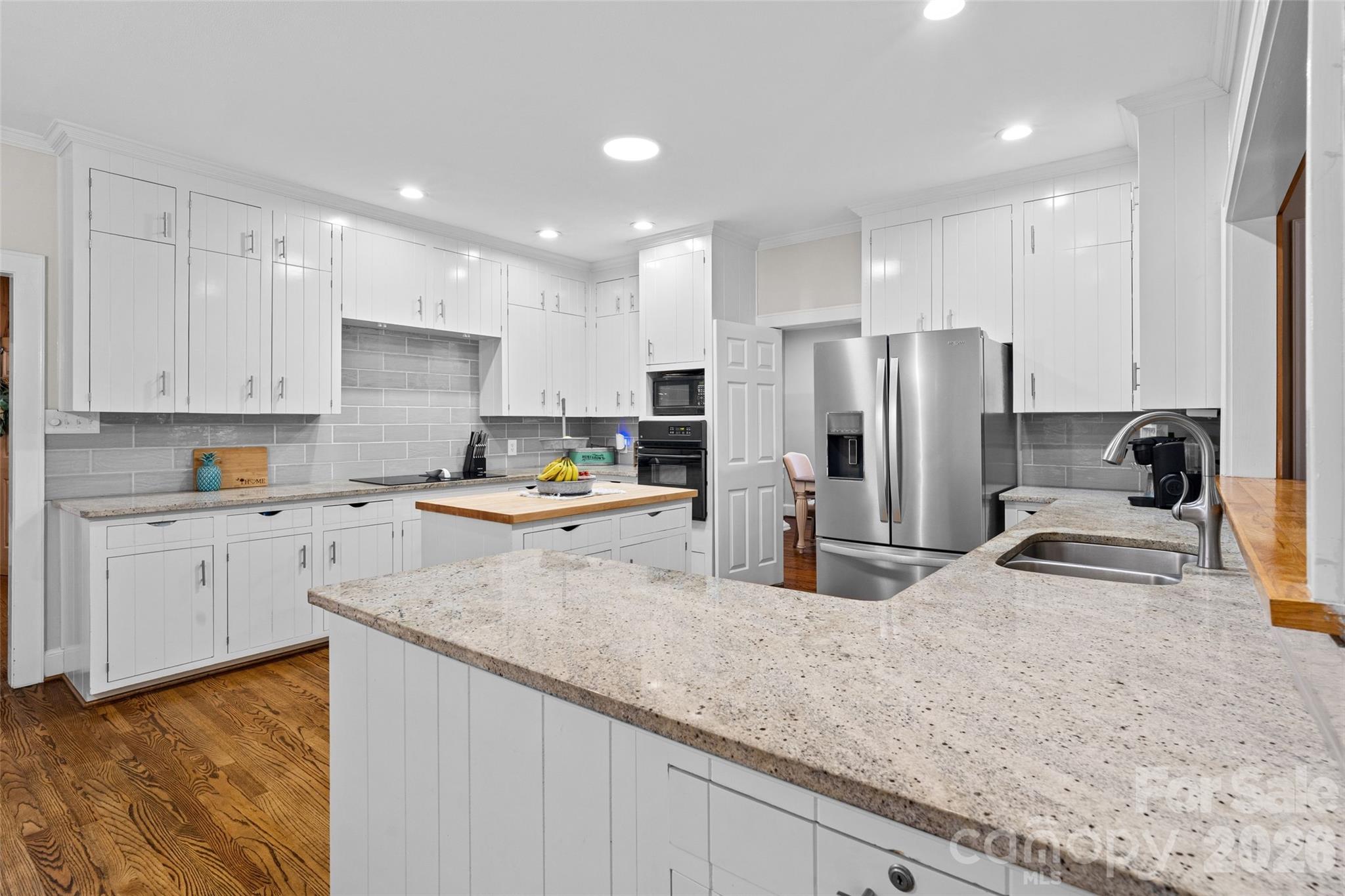 2520 Wooten Road Chester, SC 29706 - Photo 11 of 48 a kitchen with stainless steel appliances granite countertop a sink refrigerator and cabinets