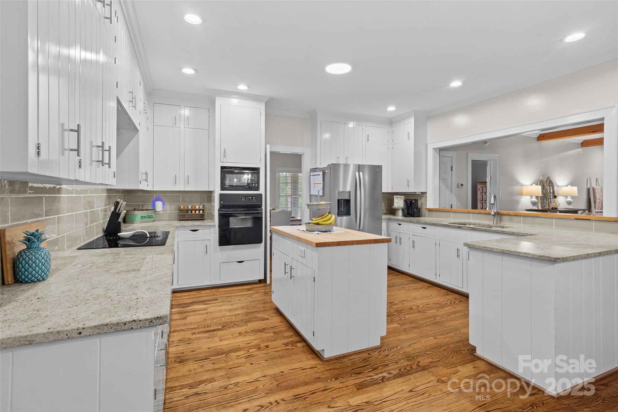 2520 Wooten Road Chester, SC 29706 - Photo 11 of 48 a kitchen with stainless steel appliances granite countertop a sink a stove top oven a counter space and cabinets