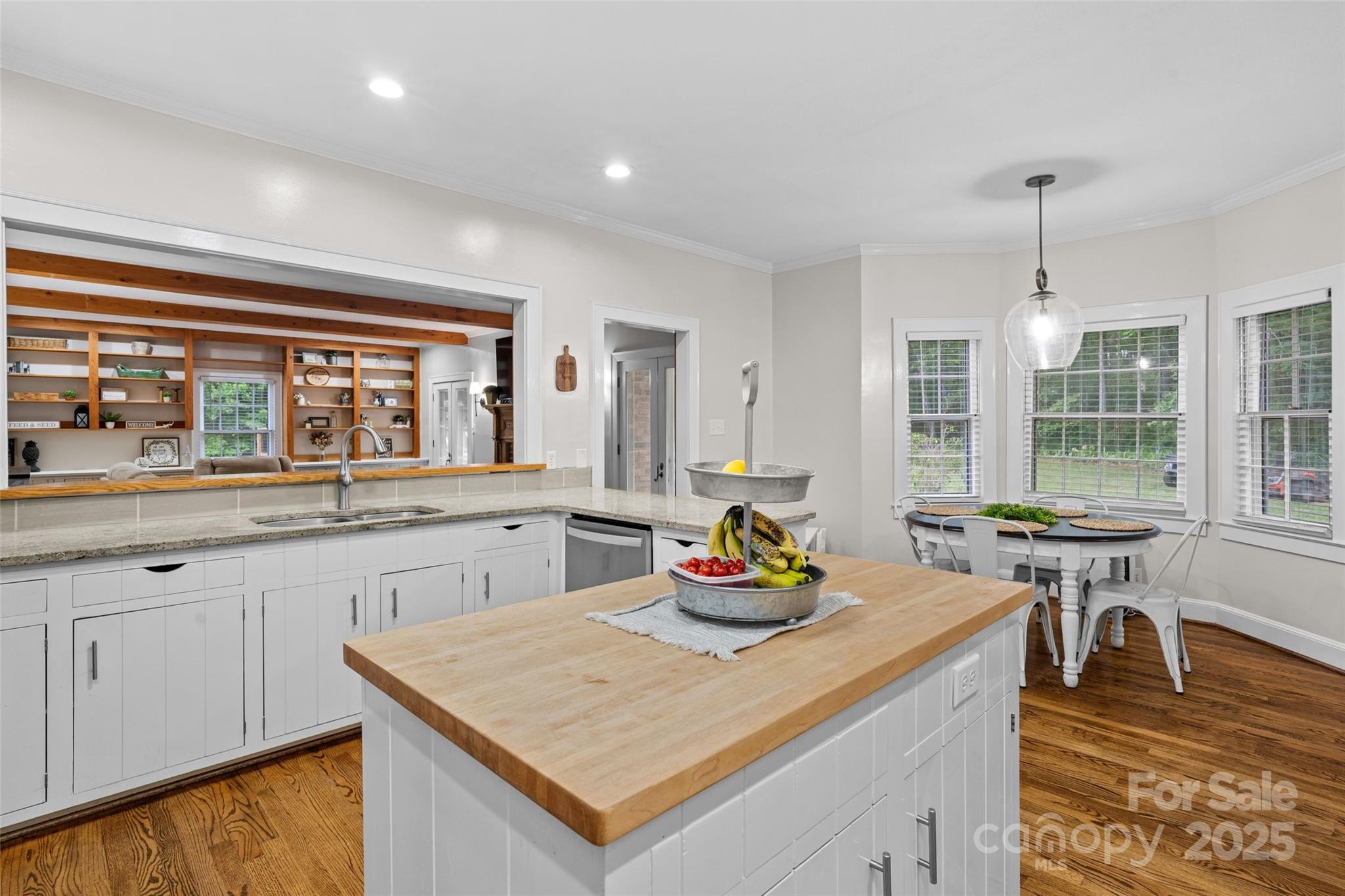 2520 Wooten Road Chester, SC 29706 - Photo 12 of 48 a kitchen with a sink a stove and chairs