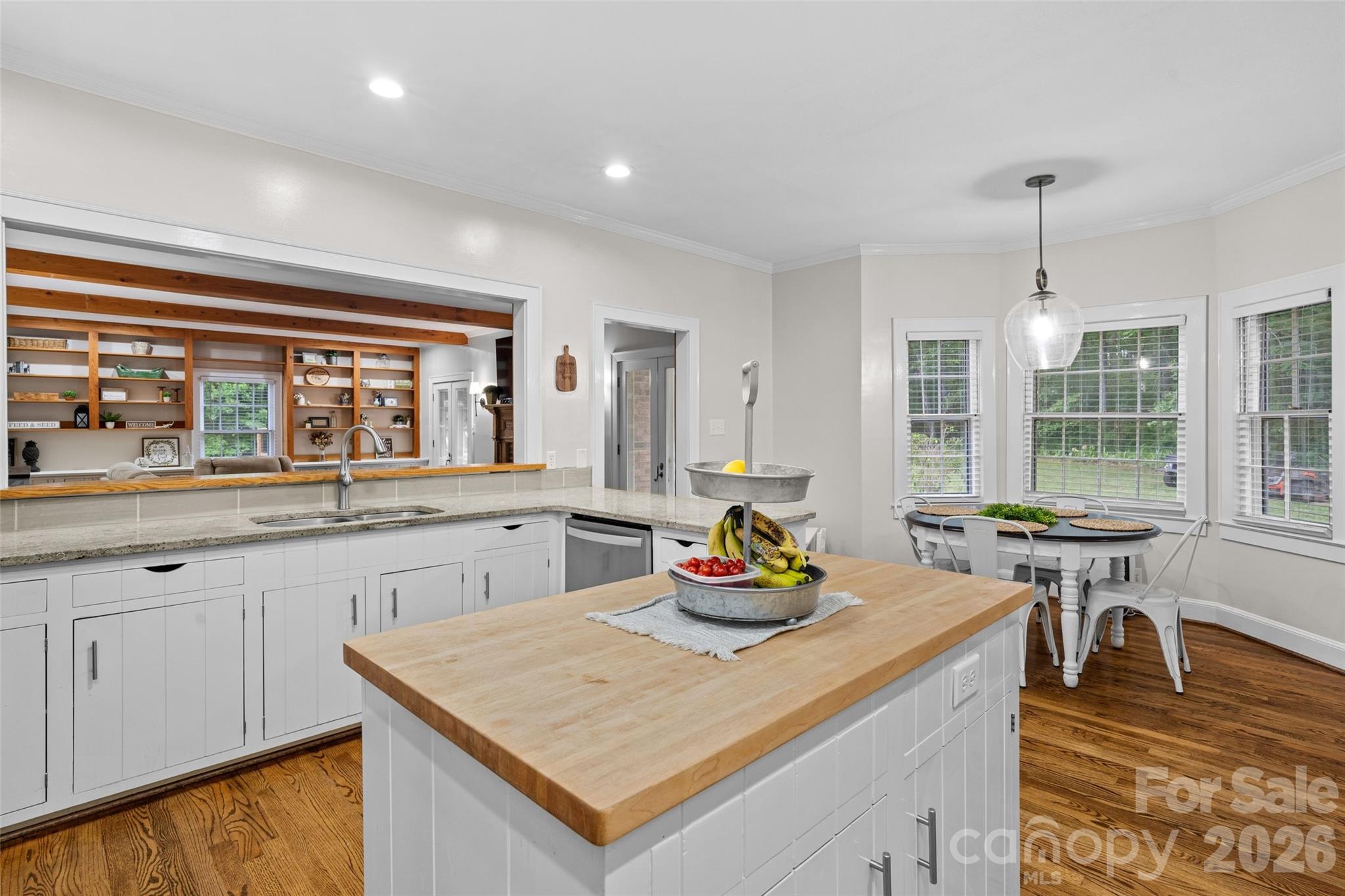 2520 Wooten Road Chester, SC 29706 - Photo 13 of 48 a kitchen with a sink a stove and chairs