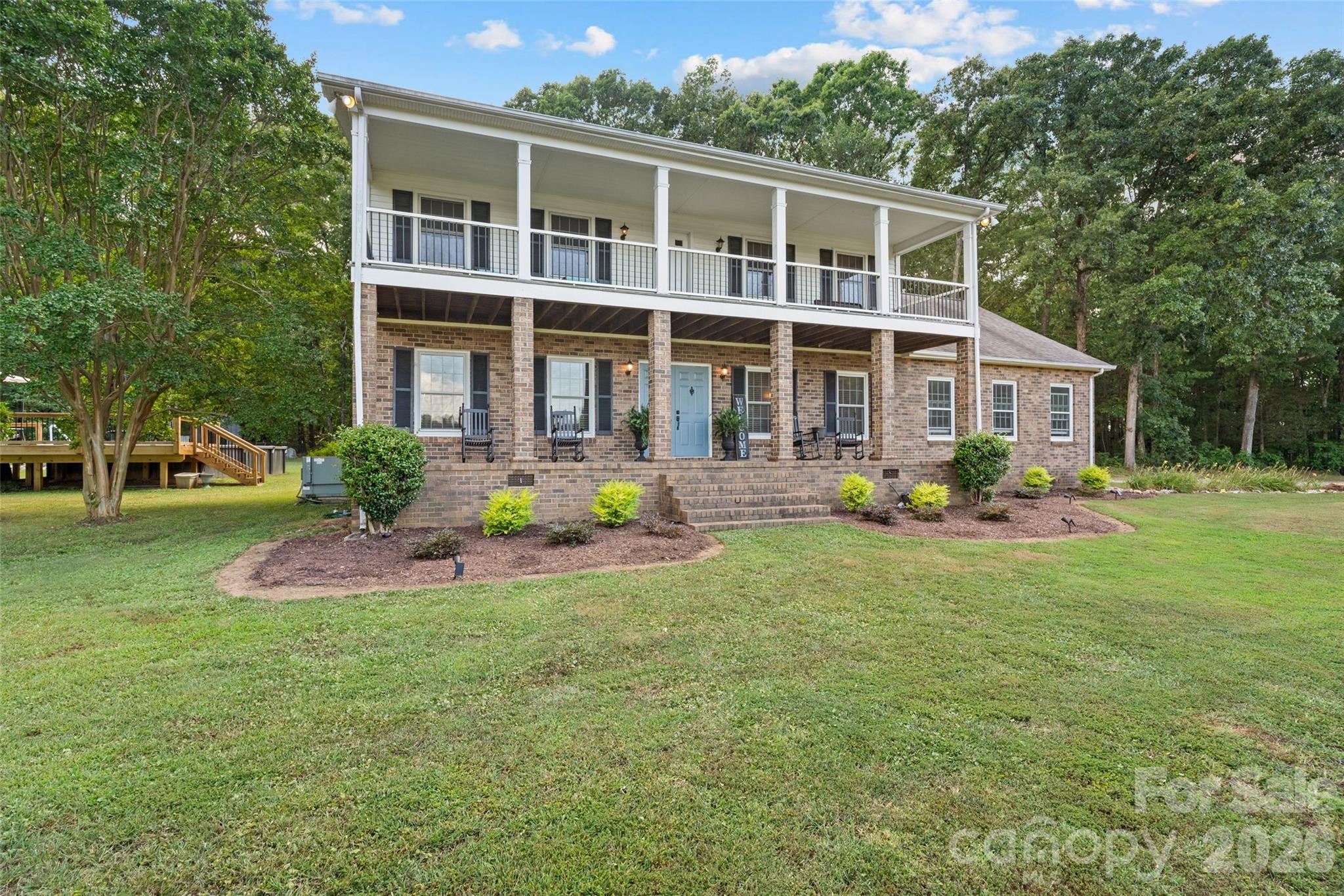 2520 Wooten Road Chester, SC 29706 - Photo 2 of 48 a front view of a house with a yard and potted plants