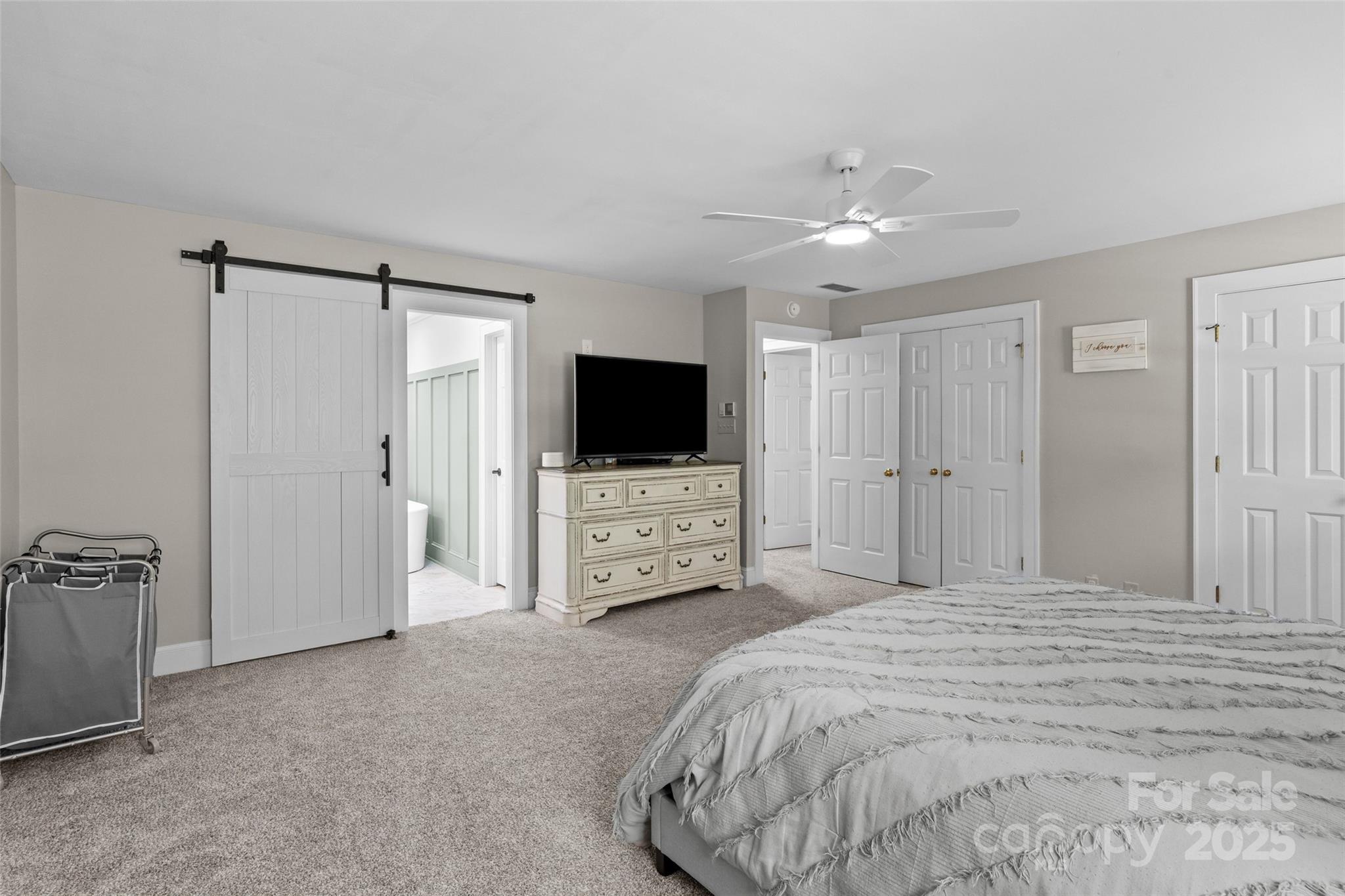 2520 Wooten Road Chester, SC 29706 - Photo 28 of 48 a bedroom with a bed and a flat tv screen on wall