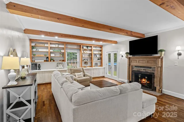 a kitchen with stainless steel appliances granite countertop a sink refrigerator and cabinets