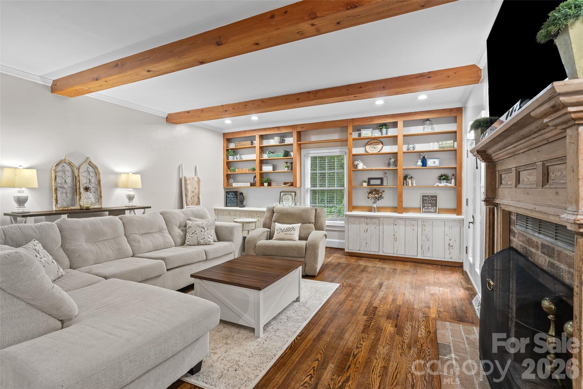 2520 Wooten Road Chester, SC 29706 - Photo 9 of 48 a living room with furniture a fireplace and a floor to ceiling window