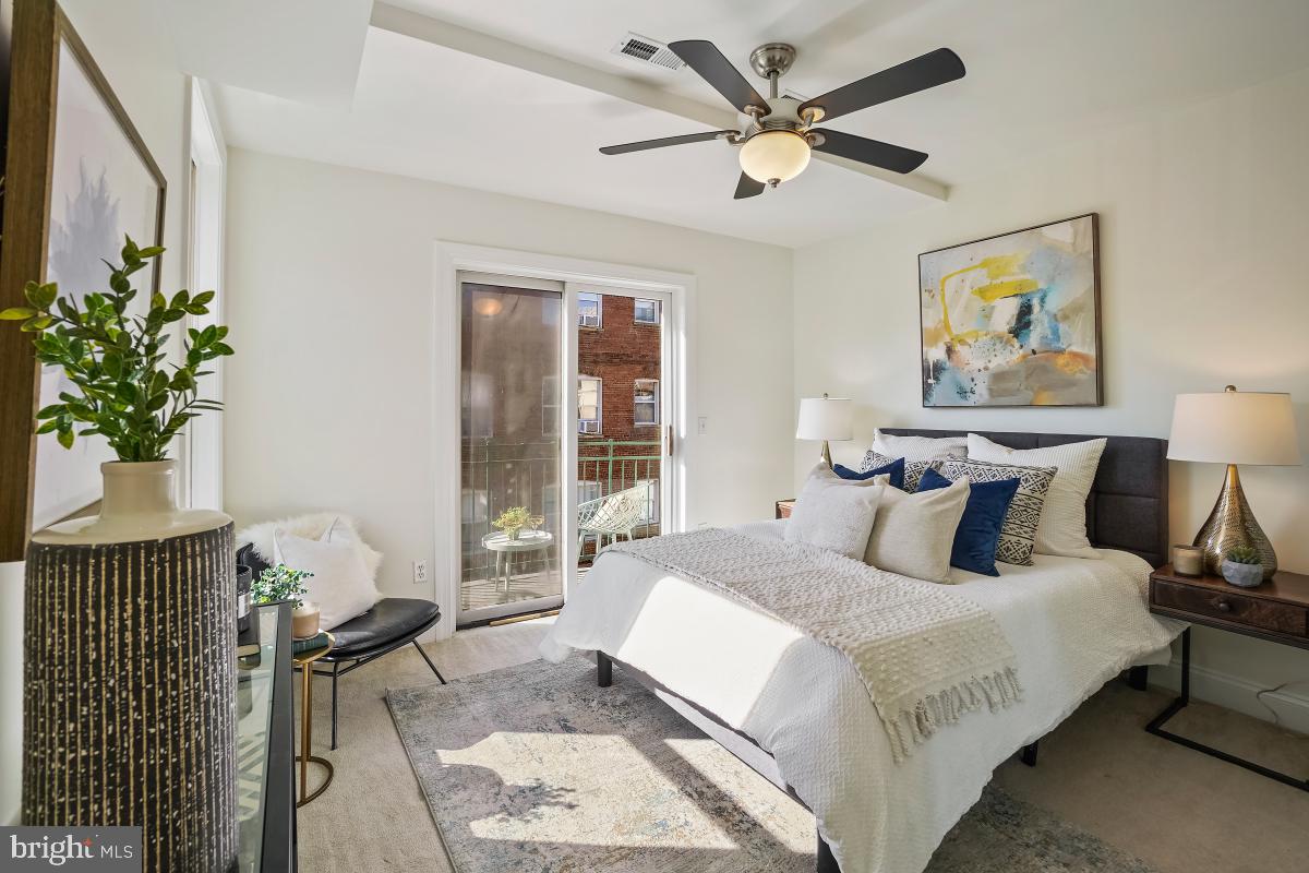 1832 Swann Street Northwest, Unit D Washington, DC 20009 - Photo 19 of 29 a bedroom with bed furniture and a window